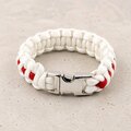 A white and red braided paracord bracelet fastened with a polished silver side-release buckle.